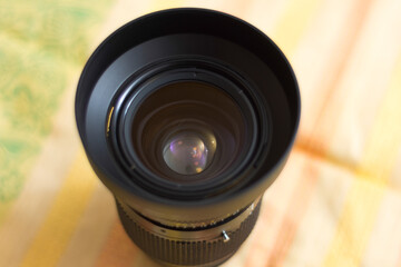 Fototapeta na wymiar Photo of a lens for a camera. The background is blurred. Shallow depth of field