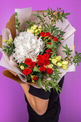 The girl with big bouquet of beutiful flowers