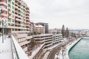 Fototapeta na wymiar Terraces of Quai du Seujet building in Geneva after snow blizzard. February 13, 2021.