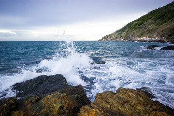 waves crashing on rocks