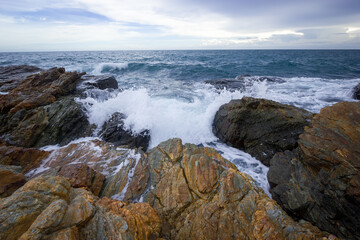 waves crashing on rocks