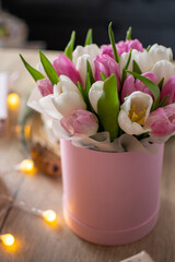 bouquet of pink and white tulips in a rose box