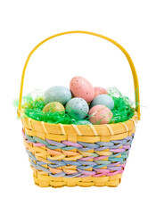 Easter eggs in a yellow wicker basket.