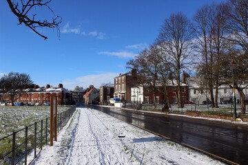 Fototapeta na wymiar Minster Yard South, Beverley, looking towards Keldgate, following a snowfall.