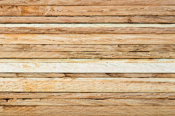 Close-up of a stack of oak strips. The horizontaly layered textured surface can serve as a background image.