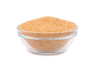 Brown sugar in a glass bowl isolated on white