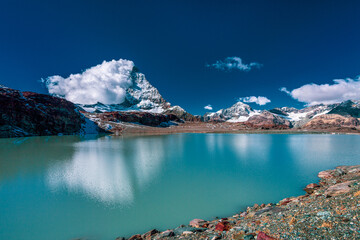 Panoramic view of Matterhorn peak, Switzerland..Matterhorn reflection in the Theodul glacier lake.