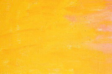 abstract colored creative background: stains of yellow paint-primer on rough linen canvas, temporary object, not an object of art.