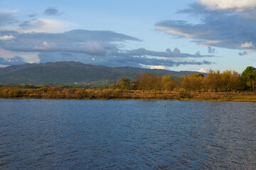 Lake view at sunset with Gardunha mountains on the background at sunset in Castelo Branco, Portugal