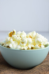 Closeup, popcorn in a bowl. Copy space.