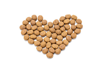 domestic animals dry food isolated on white background. dry cat feed cut out. above view. heart symbol