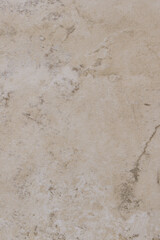 An abstract shot of a marble patterned tile with brown, white, and gray.