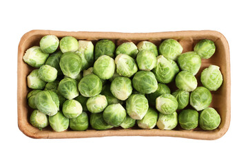 The heads of Brussels sprouts are randomly placed in a cardboard box. Box isolated on a white background.. Closeup. View from above