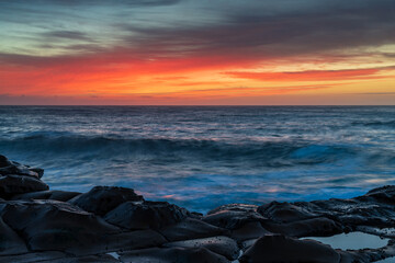 High Cloud Sunrise Seascape from Rock Platform