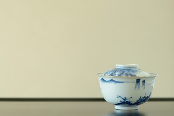 picture rice bowl. put on a Japanese lacquer shelf. This is a very fine example of Japanese traditional antique “ imari ware ” . blurred background soft focus image.