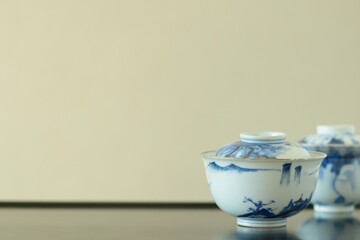 picture rice bowl. put on a Japanese lacquer shelf. This is a very fine example of Japanese traditional antique “ imari ware ” . blurred background soft focus image.