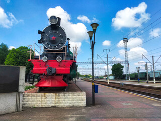 vintage green train locomotive at the station