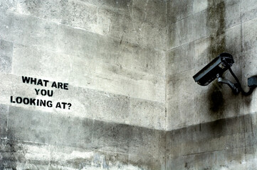 graffiti written in front of security camera, London, UK