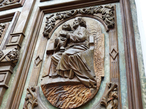 Сlose up of entrance carved wooden door of church DE LA MERCED in Cuenca city, Ecuador. Church built between 1887 and 1918.