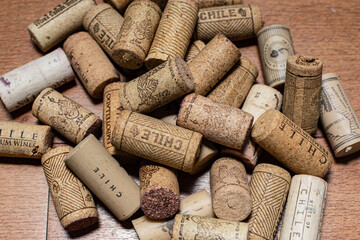 Bunch of wine corks over a white blanket
