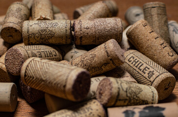 Bunch of wine corks over a white blanket
