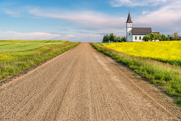 Gravel road in the country leading to the historic, yet abandoned Grand Valley Lutheran Church near...