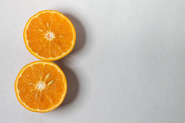 Slices of orange or tangerine isolated on white background. Flat lay, top view. Fruit composition