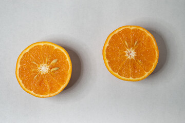 Slices of orange or tangerine isolated on white background. Flat lay, top view. Fruit composition