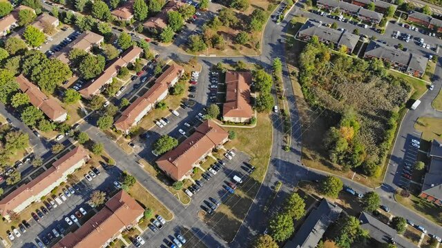 Beautiful autumn landscape on American small apartment complex in top aerial view of a typical suburb