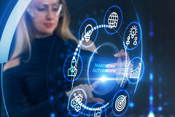 Planning marketing strategy. Business, Technology, Internet and network concept. Young businessman shows the word: Marketing automation
