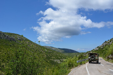 Beautiful landscape in Hvar, Croatia with greenery, sea, hills and clouds