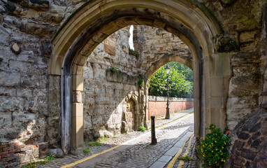 Fototapeta na wymiar medieval cobblestone path and and gatehouse