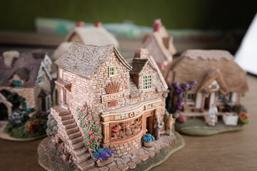 Collection of miniature ornament houses close together with depth of field