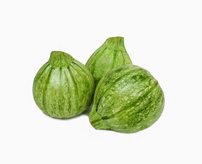  fresh round courgettes or zucchini on white background 