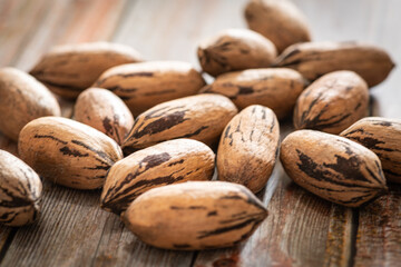 Pecan Nuts In Shell On Wood Table
