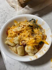 cheesy fresh made gnocchi dish with tomato sauce