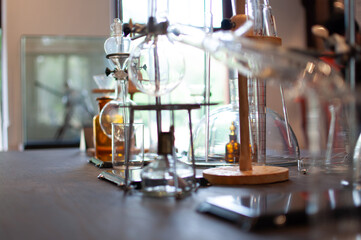 Beakers and flask glasses in chemistry science laboratory.