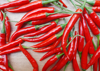 Red chili pepper on the  wood background