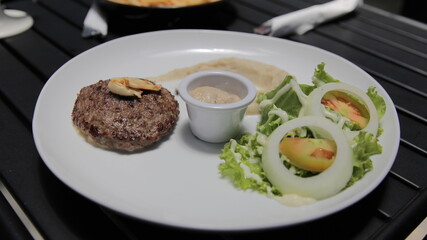 Beef Patty Steak With Mash Potato, Salad, and Mushroom Sauce