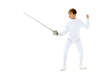 Boy fencer standing in attacking pose