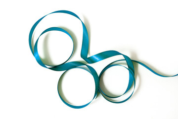 Satin ribbon on a white background. Blue ribbon.