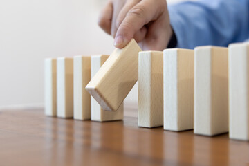 Strategies and risks of wooden games, Close-up of business people gambling with investment risk,...