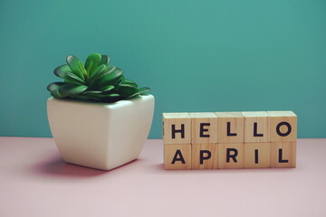 Hello April alphabet letter on blue and pink background