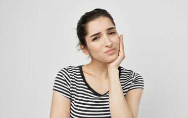 Fototapeta premium woman holding face health problems teeth pain medicine