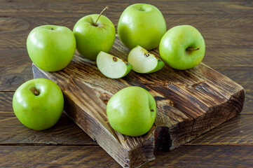 Green ripe apples on wooden desk. Rustic style. eco-friendly farming. sustainable food