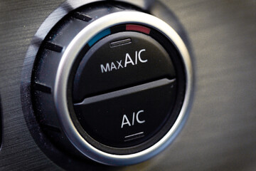 interior view of a modern new car. Climatronic or air conditioner system button.