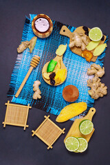 lime raw ginger honey root. Dry ginger dark background. Copy space. Flat lay. vertical photo