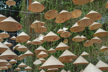 Many conical hat hanging for Vietnamese Tet holiday decoration