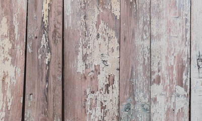 Old dried paint on a wooden background.