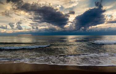 Coast of a sea and dramatic sky. Evening time. Stormy weather.